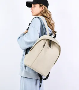 Side view of beige nylon backpack with hidden zipper and water bottle pocket detail