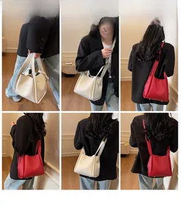Chic lychee pattern bucket bag shown in off-white and red with adjustable shoulder straps