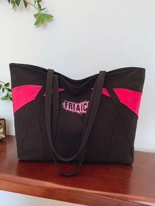 Brown canvas tote bag with pink contrast detail and large capacity for daily commuting