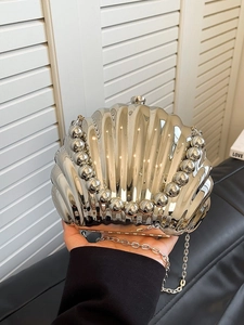 Chic silver shell-shaped evening bag with pearl bead handle and metal chain strap