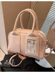 Pale pink patent leather bowling handbag with cute dog card window and shoulder strap