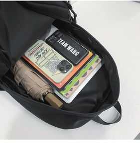 Interior view showing the large capacity of the black nylon laptop backpack for school