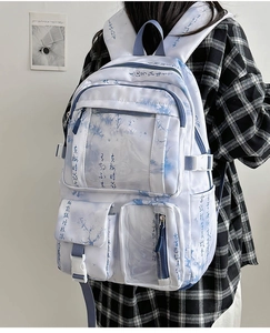 Detail of the blue and white marble pattern backpack with artistic Chinese calligraphy