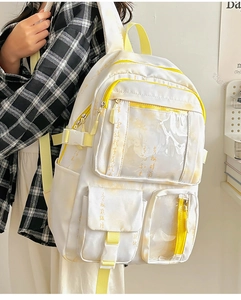 Detail view of large white school backpack with yellow straps and Chinese calligraphy design
