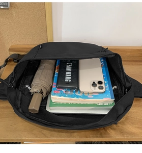 Internal view showing large storage capacity for umbrella, power bank, and smartphone