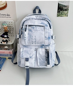Detail of blue ink print backpack with multi-pocket design and transparent PVC window