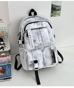 Detailed close-up of water ink style backpack with Chinese calligraphy and multiple pockets