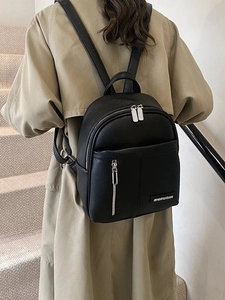 Women's black lychee pattern leather backpack with silver hardware and dual zippers