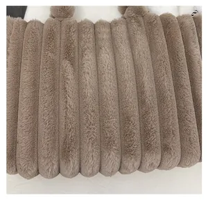 Detail of plush tote bag showing high-quality faux fur texture and soft vertical stripes