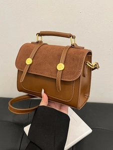 Vintage brown crossbody bag in mixed leather and suede textures with top handle