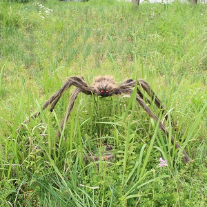 Macro shot of realistic fuzzy giant spider with red eyes for Halloween yard decoration