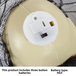 Macro detail of Halloween glowing skull base showing AG3 battery box and power switch