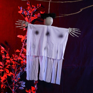 Detailed view of Halloween ghost decoration with skeleton hands and white fringe robe