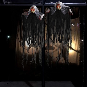 Detail of hanging Halloween glowing ghost brides with red eyes and lace veils