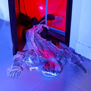 Creepy crawling skeleton with long white hair and grey tattered robes for Halloween decor