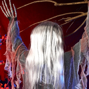 Detailed close-up of a creepy Halloween ghost with long hair and skeletal hands