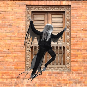 Creepy Halloween climbing ghost prop with white hair on vintage red brick wall
