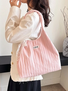 Pink pleated tote bag with LOVE label and lace scarf accessory for casual daily use