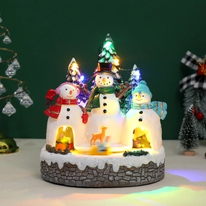 Luminous Christmas snow house with snowmen, deer, and LED lights on a resin stone base