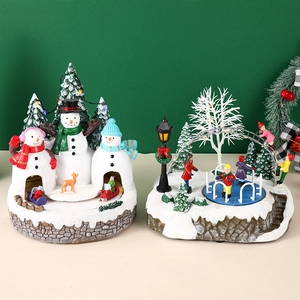 Illuminated Christmas resin houses with rotating sled and ice skating rink scene