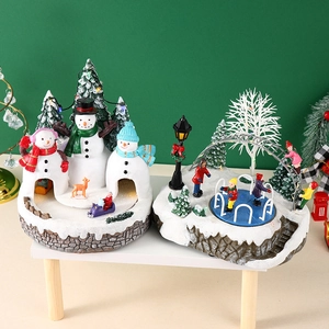 Detailed view of LED lighted Christmas snow village resin crafts with miniature snowmen