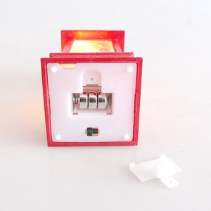 Detail of red lantern base showing battery compartment with 3 button cells and ON/OFF switch