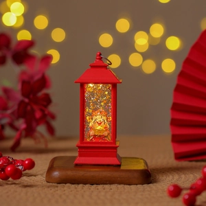 Festive Chinese God of Wealth night light with flowing gold sequins and red lantern frame