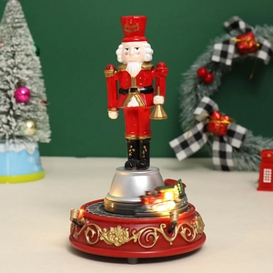 Caja de música Cascanueces navideño con luz, tren en movimiento y adornos oro