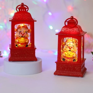 Close-up of red Chinese God of Wealth lanterns with LED light and gold glitter effect