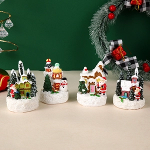 Detail of 4-piece LED Christmas village set with Santa and snowman resin miniatures