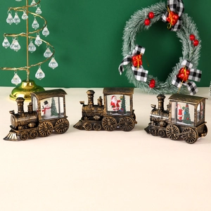 Vintage Christmas train lanterns with Santa and snowman scenes in bronze finish