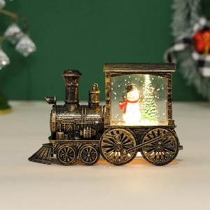 Vintage bronze Christmas train lantern with glowing water globe and snowman scene