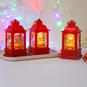 Close-up of three red retro God of Wealth lanterns with festive warm light and glitter