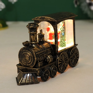 Close-up of vintage train lantern with warm LED light and Santa Claus miniature scene