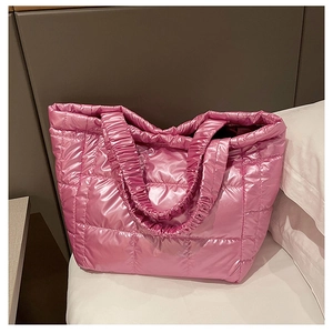Close-up of pink metallic quilted tote bag with unique gathered elastic handle detail