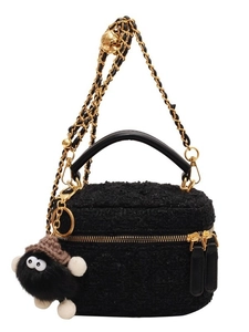 Chic black fuzzy plush handbag with chain strap and cute coal sprite mascot charm