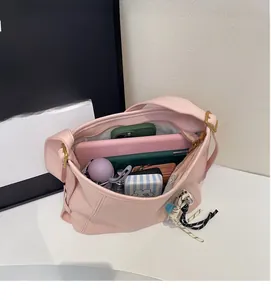 Top view showing the large internal capacity of the pink matte shoulder bucket bag