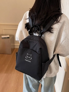 Minimalist black waterproof nylon backpack with cat print for travel and school