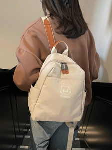 Minimalist beige waterproof nylon backpack with cat pattern and brown leather straps