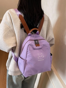 Minimalist light purple waterproof nylon backpack featuring a cute cat design