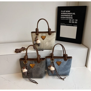 Detailed view of stylish tote bags with marble texture and knot handle design