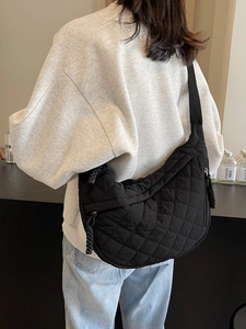 Chic black quilted half-moon crossbody bag with large capacity for casual commuting