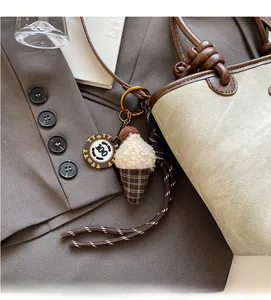 Creative ice cream cone charm with plush ball on a canvas tote bag accessory