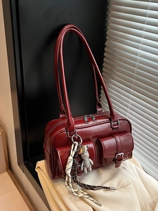 Retro deep red shoulder bag with dual buckle pockets and a cute bear charm decoration
