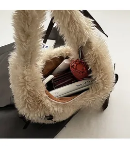 Internal view of beige plush shoulder bag showing spacious capacity for daily items