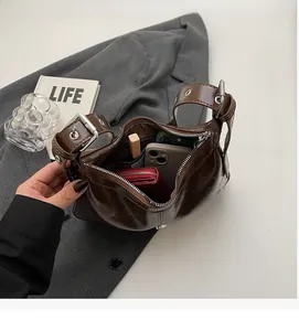 Interior view of brown faux leather hobo bag showing spacious capacity for daily essentials