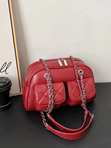 Vintage red quilted hobo bag with silver chain straps and dual front flap pockets