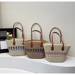 Three handmade straw tote bags with premium leather handles in various woven patterns