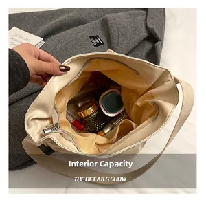 Top view of cream tote bag interior featuring zipper pocket and spacious storage