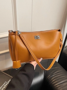 Brown minimalist vintage shoulder bag in synthetic leather with silver metal twist lock